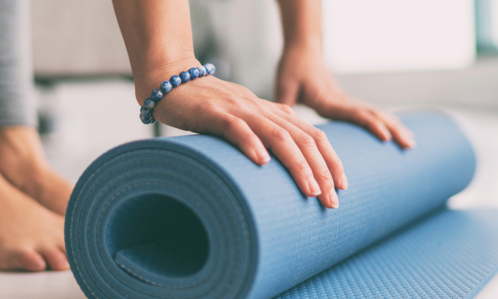 Yoga class types. woman with yoga mat